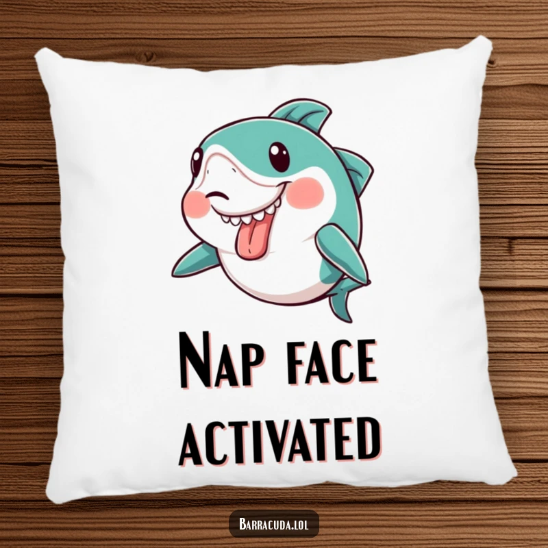Funny kawaii barracuda making a silly face with its tongue sticking out slightly on a soft pillow, bringing humor to comfort.