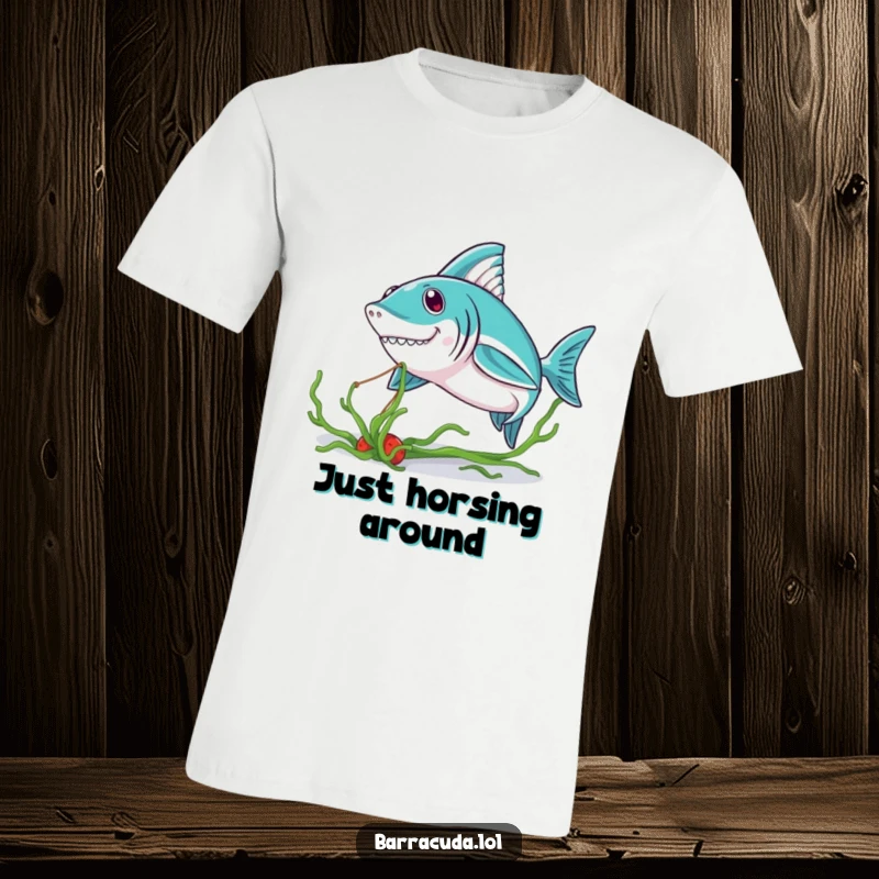 Funny Kawaii Barracuda T-Shirt: a charming barracuda playfully tugging a seaweed strand, radiating cuteness and ocean vibes.